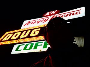 A Krispy Kreme sign that says Doug